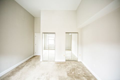 Rittenhouse Row apartment home interior with tall ceilings and carpeted flooring